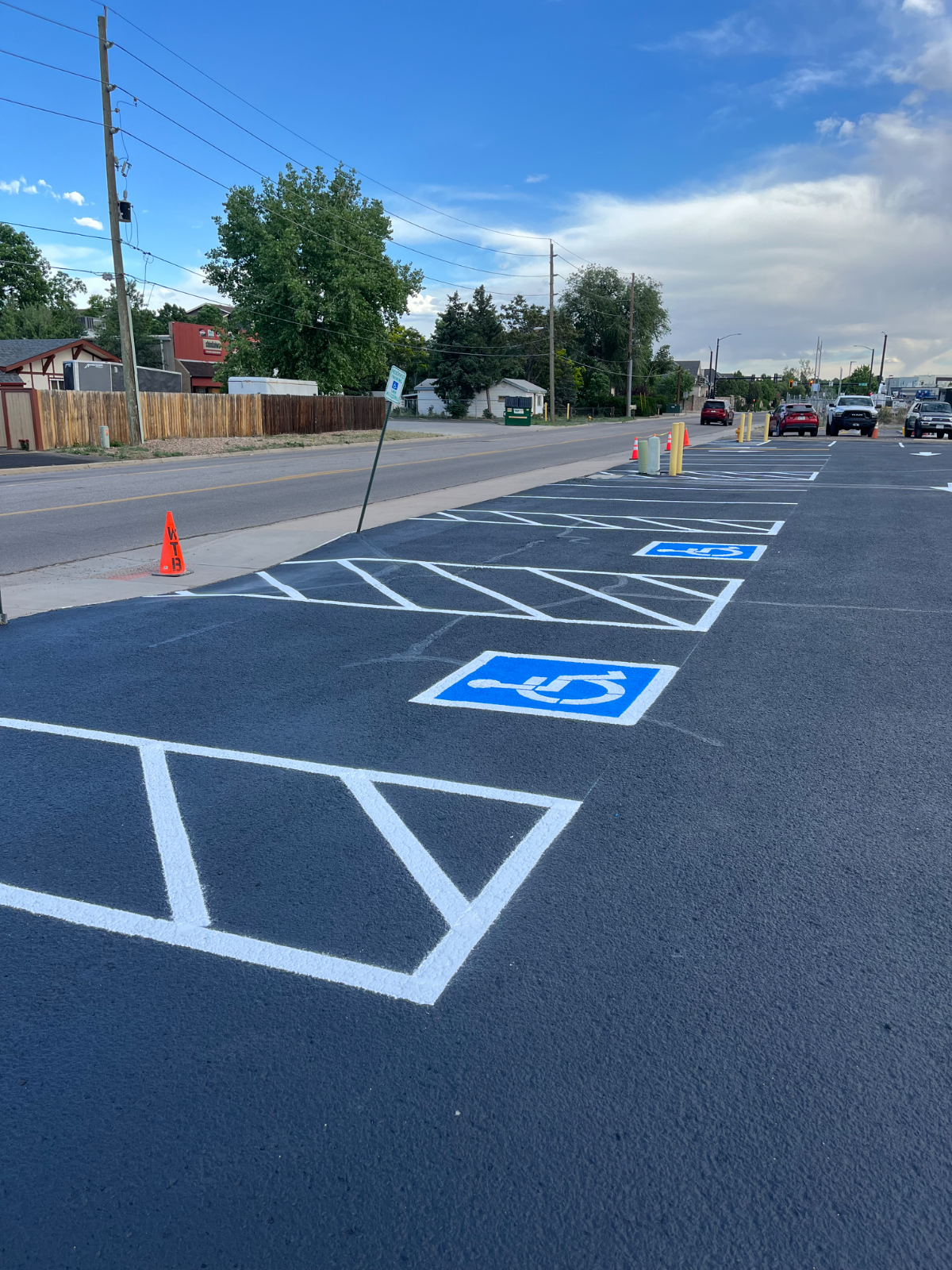 Freshly striped ADA accessible parking spaces in a Denver parking lot